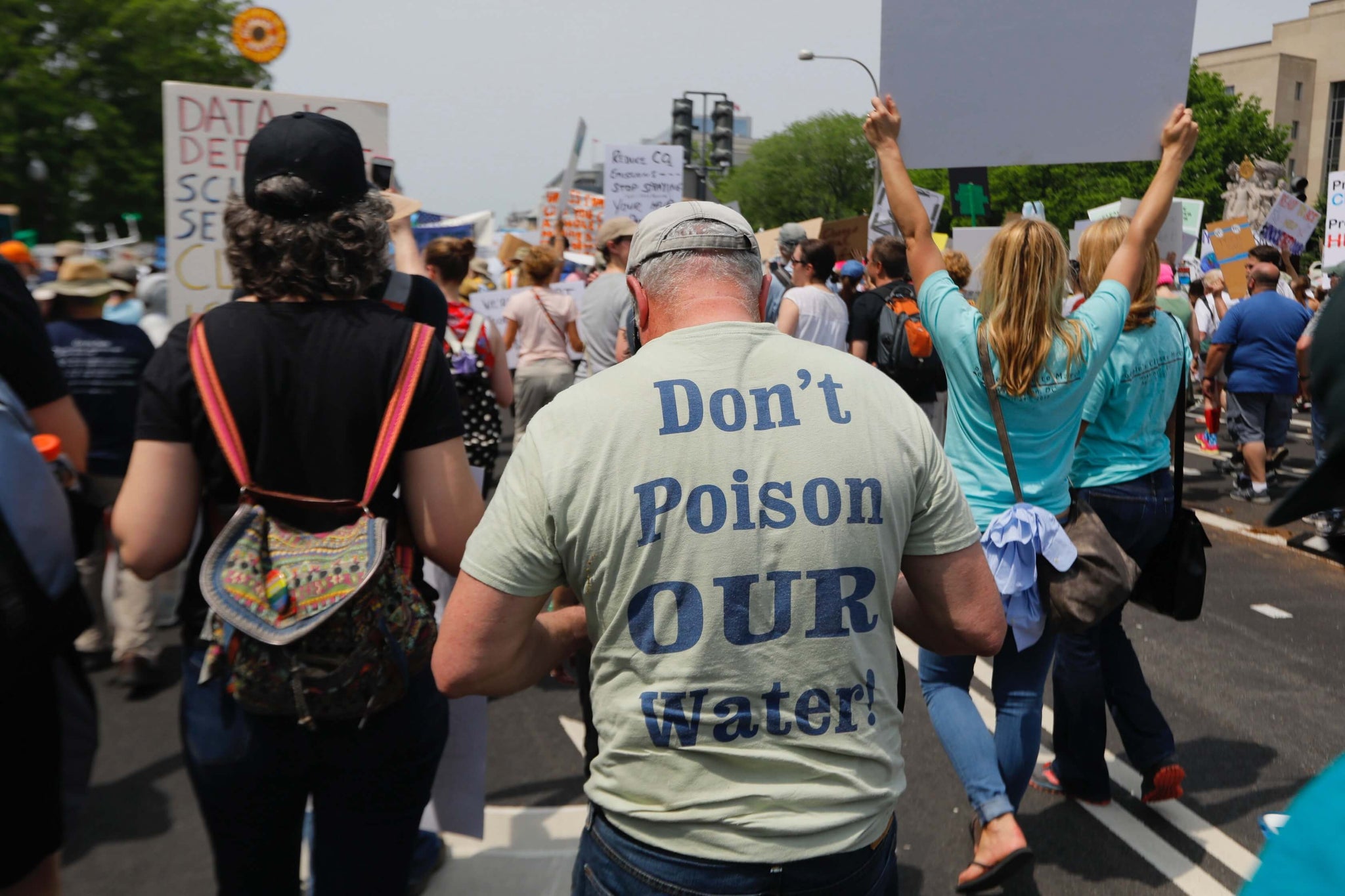 People protesting against the corporations damaging the environment