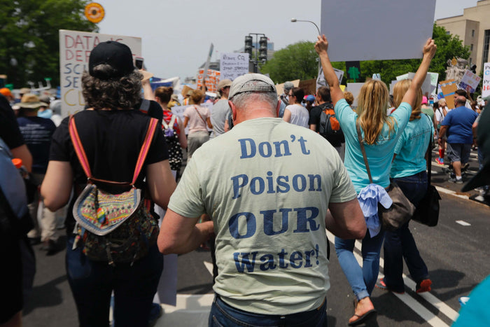 People protesting against the corporations damaging the environment
